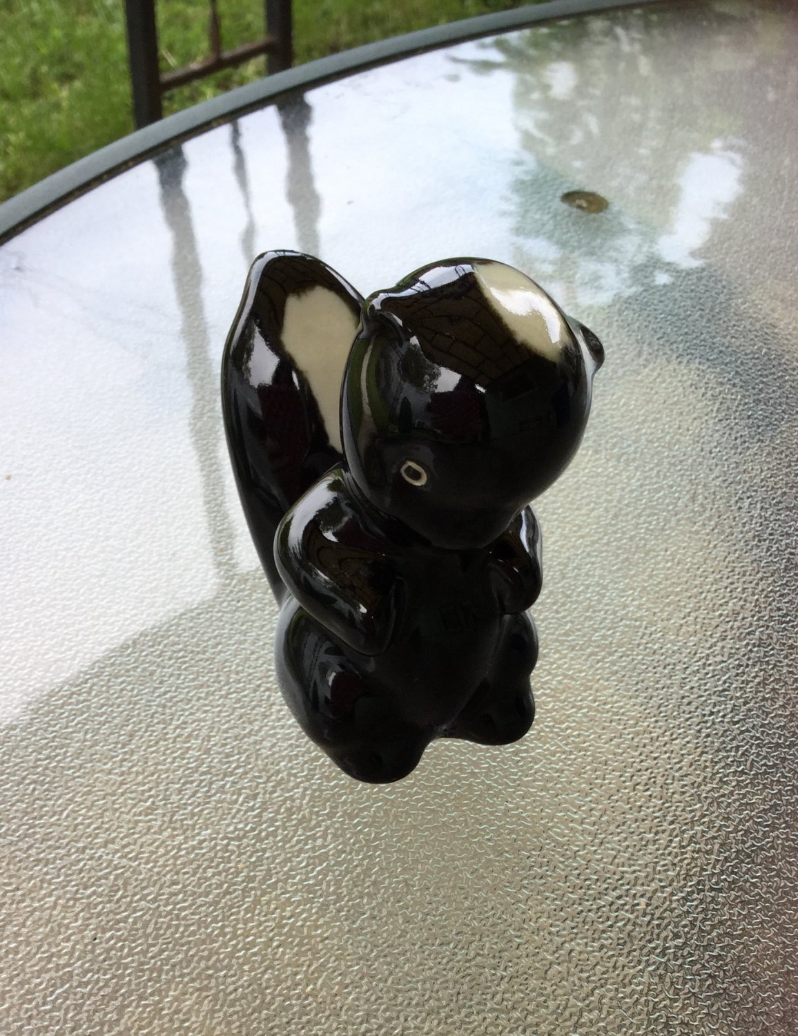 ceramic skunk figurines
