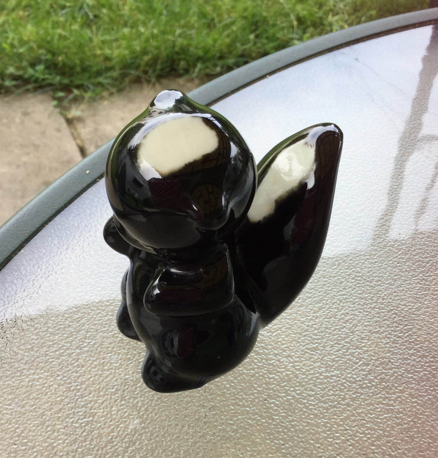 ceramic skunk figurines