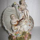 Dresden Winged Cherub Instrumental Shell Figurine