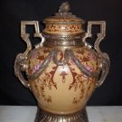 PAIR OF PORCELINE AND BRONZE FLORAL URNS