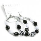 Medium hoop earrings with black, silver and zebra print beads