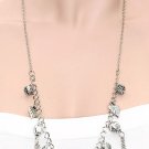 Ladies long silver tone charm necklace and matching earrings