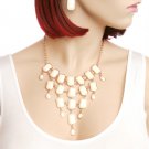 Beautiful bib necklace w/ ivory colored stones & gold tone links matching earrings included