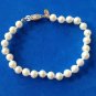 LOVELY "MONET" COSTUME PEARL KNOTTED STRAND BRACELET 1/4" X  7 1/4". VERY NICE !