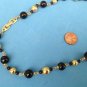 VINTAGE 24"  "NAPIER" BLACK & GOLD TONE NECKLACE. LARGEST BEAD IS 1/2" DIAMETER