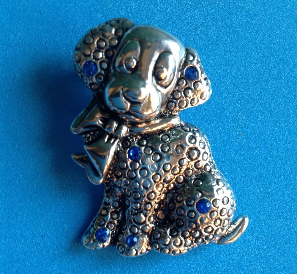 PRECIOUS PUPPY PIN. SILVER TONE WITH BLUE RHINESTONES..ADORABLE! SIGNED "MIA"?