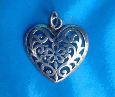 Silver heart pendant, cut out. Unmarked. 1 3/8" with loop x 1  1/4".