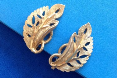 " B.S.K." clip leaf earrings gold tone textured & shiny. Vintage.
