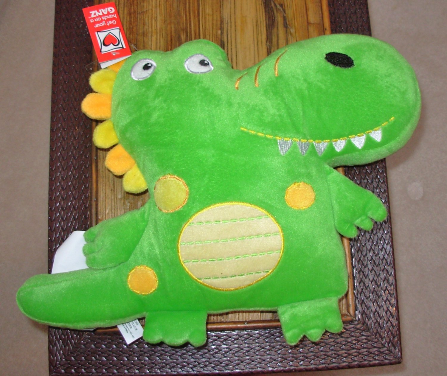 green dinosaur pillow