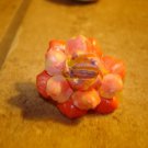 Delicate plastic button in shape of flower.