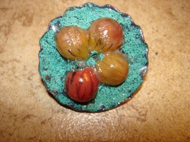 Large fruit bowl metal button with grapes.