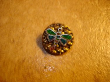Gold metal button with dragonfly with green wings.