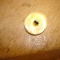 Vintage mother of pearl button with tiny red rhinestone.