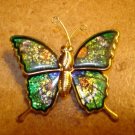 Gold metal and green cloisonne button in shape of butterfly. Gold metal and green cloisonne button in shape of butterfly.