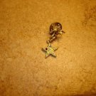 Gold metal angel pin with star and tiny rhinestones.