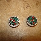 Two silver metal buttons with Christmas holly.