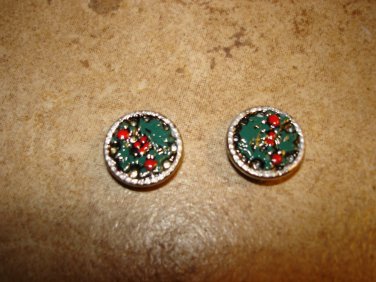 Two silver metal buttons with Christmas holly.