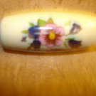 Large plastic oblong button with flowers. Large plastic oblong button with flowers.