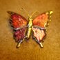 Gold metal and cloisonne button in shape of butterfly.