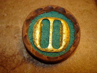 Extra large wood button with gold metal buckle.