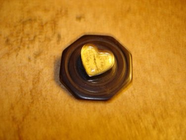 Black plastic button with hart shape watch.