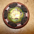 Extra large plastic button with silk brade and yellow flower. Extra large plastic button with silk brade and yellow flower.