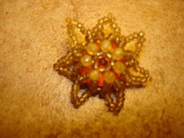 Beautiful floral button made out of tiny beads.