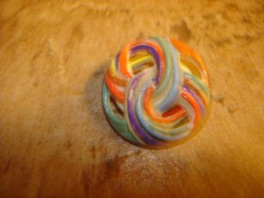 Pierced plastic colorfully painted button.