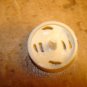 Pierced plastic colorfully painted button.