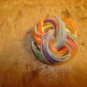 Pierced plastic colorfully painted button.