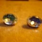 Lot of 2 faceted glass and metal buttons with glitters inside
