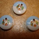 Set of 3 Christmas buttons with snowman, Christmas gift and tree. Set of 3 Christmas buttons with snowman, Christmas gift and tree.
