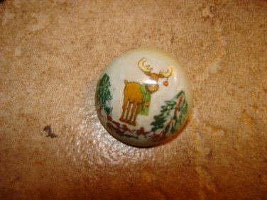 Dome shape Christmas button with moose and Christmas tree.