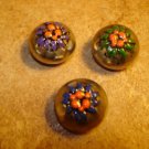 Set of 3 old dome shape silver metal buttons with flowers.