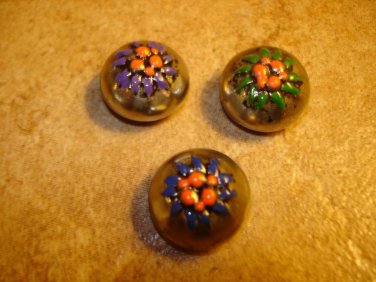 Set of 3 old dome shape silver metal buttons with flowers.