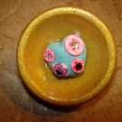 Large wood bowl  button with treasure inside.