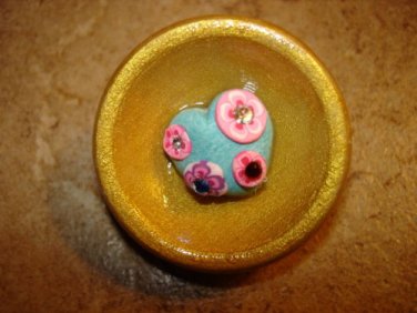 Large wood bowl  button with treasure inside.