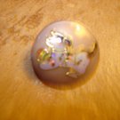 Plastic button with dog playing with ball. Plastic button with dog playing with ball.