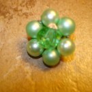 Vintage metal button with green pearls and green glass bead.