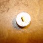 Vintage gold metal button with beautiful glass bead.