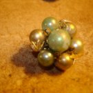 Vintage button with pearls and metal back.