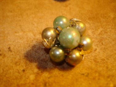 Vintage button with pearls and metal back.