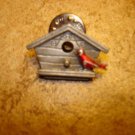 All metal bird house with little bird pin back badge. All metal bird house with little bird pin back badge.