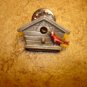 All metal bird house with little bird pin back badge.