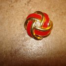 Gold and red art nouveau style metal button. Gold and red art nouveau style metal button.