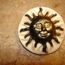 Large faux bone button with smiling sun.