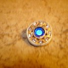Beatiful gold tone metal button with large blue rhinestone