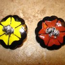 Set of 2 carved plastic buttons with silver metal elephants. Set of 2 carved plastic buttons with silver metal elephants.