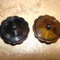 Set of 2 carved plastic buttons with silver metal elephants.