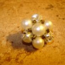 Vintage button with white pearls and metal back.